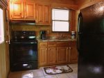 Updated kitchen with new stove and refrigerator